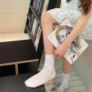 Women white cotton mid-calf socks with cute bow embroidery, comfortable daily wear hosiery.