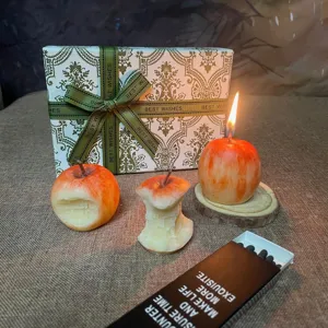 Hand-painted apple shaped scented candle set, creative fruit holiday gift detail view.