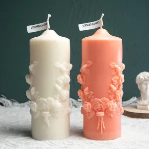 Scented pillar candle with exquisite 3D rose flower relief design for romantic home decor.