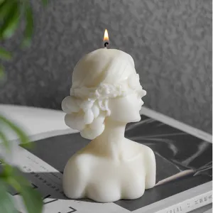Aromatherapy scented candle featuring a blindfolded female bust design, elegant home decor.