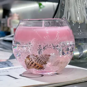 Vela aromática de cristal con concha rosa en cuenco de vidrio decoración hogar