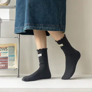Women cotton ribbed mid-calf socks detail, sweet lettuce edge design with small woven label.