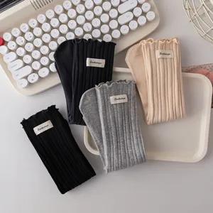 Women's cute ruffle ribbed crew socks autumn winter casual knit hosiery with cloth label.