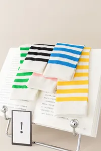 Breathable striped socks detail view, soft summer candy color mid-tube cotton socks close up.