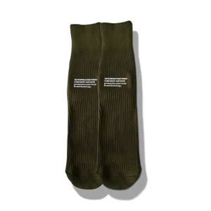 Close-up detail of military green crew socks with stylish letter print. Soft knit fabric.