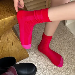 Red color-blocked vertical striped mid-tube socks, cozy knit daily wear fashion accessory details.