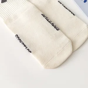 Minimalist trendy casual socks with side knit text, high street style couple long socks.