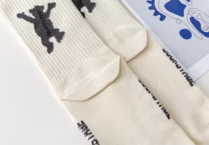 Minimalist dancing bear knitted long socks detail, cozy cotton casual fashion wear for couples.