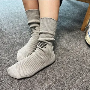 Japanese style casual ribbed slouch socks for men and women, featuring stylish letter print.