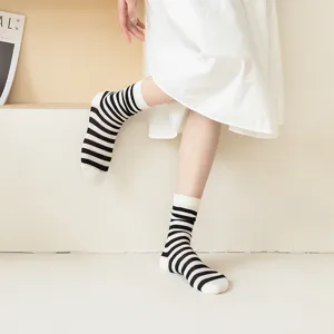 Close-up detail shot of breathable striped mid-tube socks featuring a retro design.