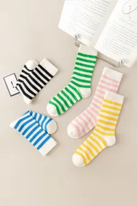 Detailed shot of colorful striped mid-tube socks in candy colors, breathable and retro style.