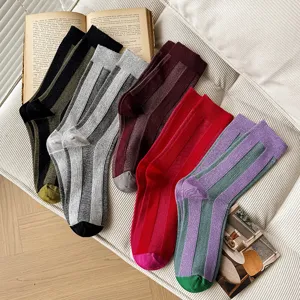 Detail view of stylish color-blocked vertical striped casual mid-tube socks in multi-colors.