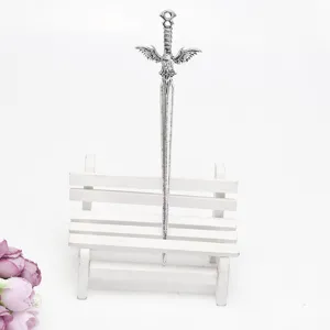 Detailed view of a creative retro sword shaped hair stick, vintage metal hair fork hairpin.