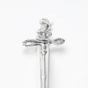 Close-up view of the silver sword metal hair stick, showing exquisite curved tentacle details.
