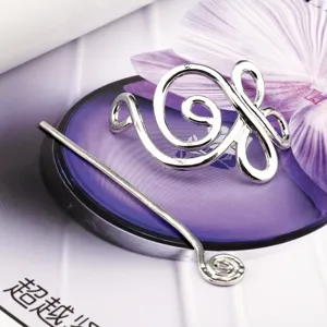 Detail view of vintage Viking Celtic style metal hair pin, retro silver hairpin for women.
