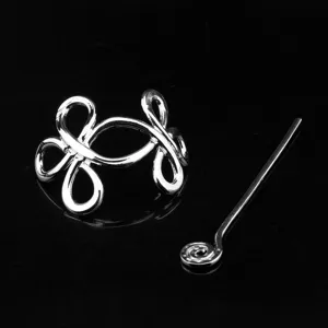 Viking Celtic knot metal hair pin detail, retro silver hair clip accessory for women close-up.