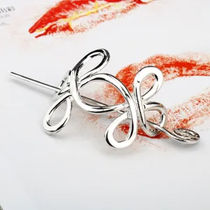 Vintage silver metal hair fork with abstract knot design, elegant viking hair accessory.