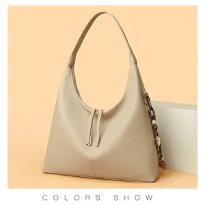 Elegant leather hobo shoulder bag with stylish tassel zipper and premium texture details.