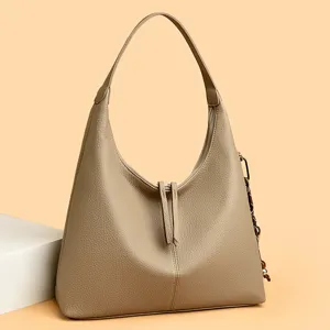 Elegant genuine leather shoulder hobo bag for women, spacious daily commute tote purse.
