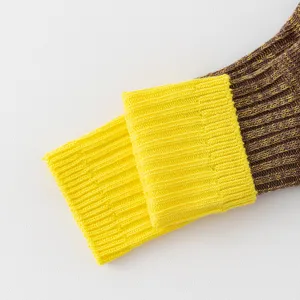 Chunky knit socks detail shot featuring brown and yellow ribbed cuff design, soft and cozy.