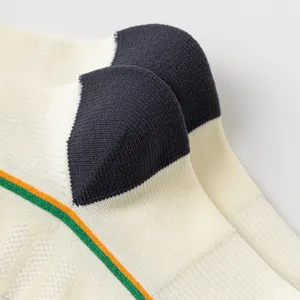 Breathable mesh athletic compression socks detail view showing knit texture and contrast heel.