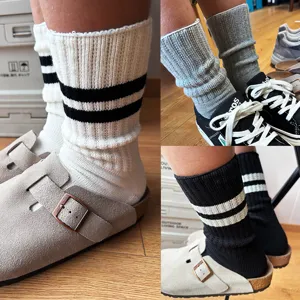 Detailed view of Japanese style casual striped mid-calf knit cotton socks worn with shoes.