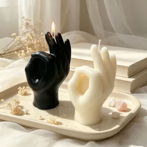Hand gesture scented candle detail view, aesthetic black and white palm shape decor soy wax.