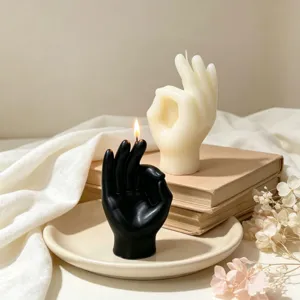 Hand gesture scented soy wax candle detail shot aesthetic home decor table ornament