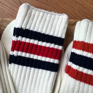 Close-up detail of cozy Japanese-style thick striped cotton socks with ribbed cuffs.