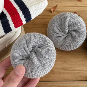 Close-up view of thick brushed grey winter cotton socks with soft plush texture details.