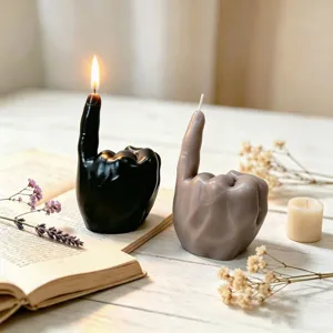 Hand gesture scented candle detail view, unique finger sculpture home decor, cozy aesthetic vibe.
