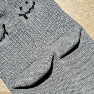 Grey knitted socks with cute melting smiley face embroidery, casual thick knit cotton short socks.