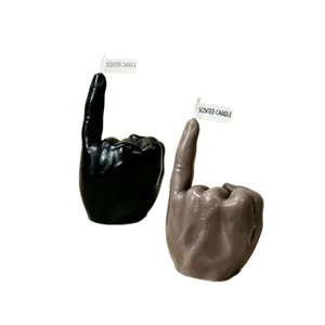 Creative hand gesture scented candle home decor, unique wax sculpture ornament in black and grey.