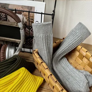 Detailed view of vintage knit crew socks in neutral colors, styled in a basket for daily wear.