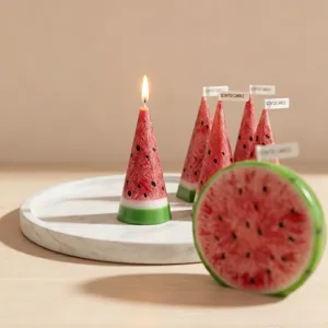 Close-up detail of handmade watermelon scented candle with ice-crack texture on tray.