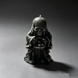 Gothic black grim reaper skull scented candle detail, perfect for Halloween home decor.