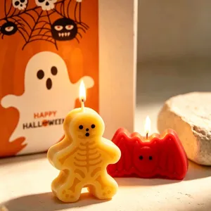Halloween scented candle set featuring cute skeleton and bat shapes with festive packaging box.