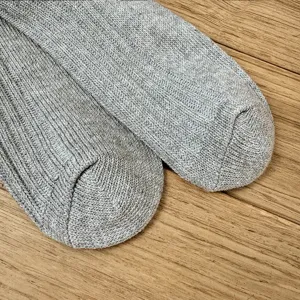 Close-up detail showing the ribbed knit texture and grey color of the casual socks.