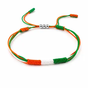 Handmade woven friendship bracelet with green white orange flag colors and beads