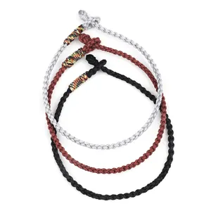 Handmade woven rope bracelets set in grey, brown, and black with knotted texture detail