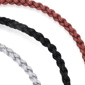 Macro close-up showing the intricate texture of hand-woven braided rope bracelets in multi-color