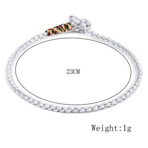 Detailed macro view of silver hand-woven bracelet with 23cm length and 1g weight