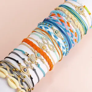 Set di braccialetti intrecciati bohémien con ciondoli occhio del male e mano di fatma