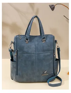 Detailed view of the blue soft leather multi-functional backpack showing texture and hardware.