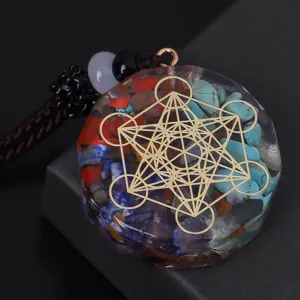 Close-up detail of Metatron's Cube resin pendant with vibrant mixed crystal stones and beads