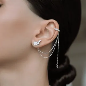 Detailed view of 925 sterling silver star earring with elegant zircon tassel ear cuff on ear