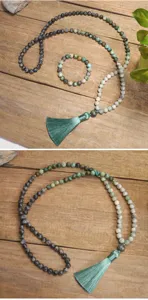 Close-up of 108 African turquoise and labradorite stone beads with a long green silk tassel