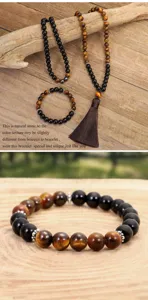 Set di collana e braccialetto fatto a mano con 108 perle occhio di tigre e nappa marrone