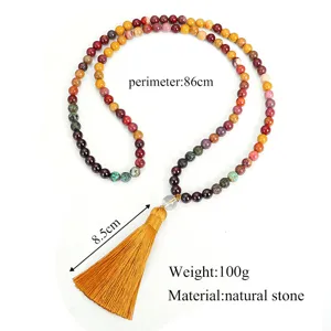 Detail of 108 natural stone bead necklace with 86cm perimeter and yellow tassel