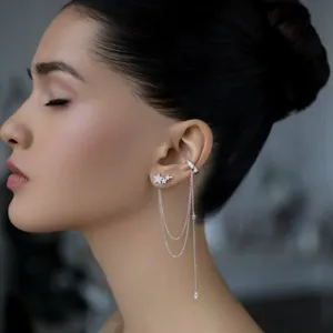 Detailed side view of 925 sterling silver star earring with chain tassel and ear cuff